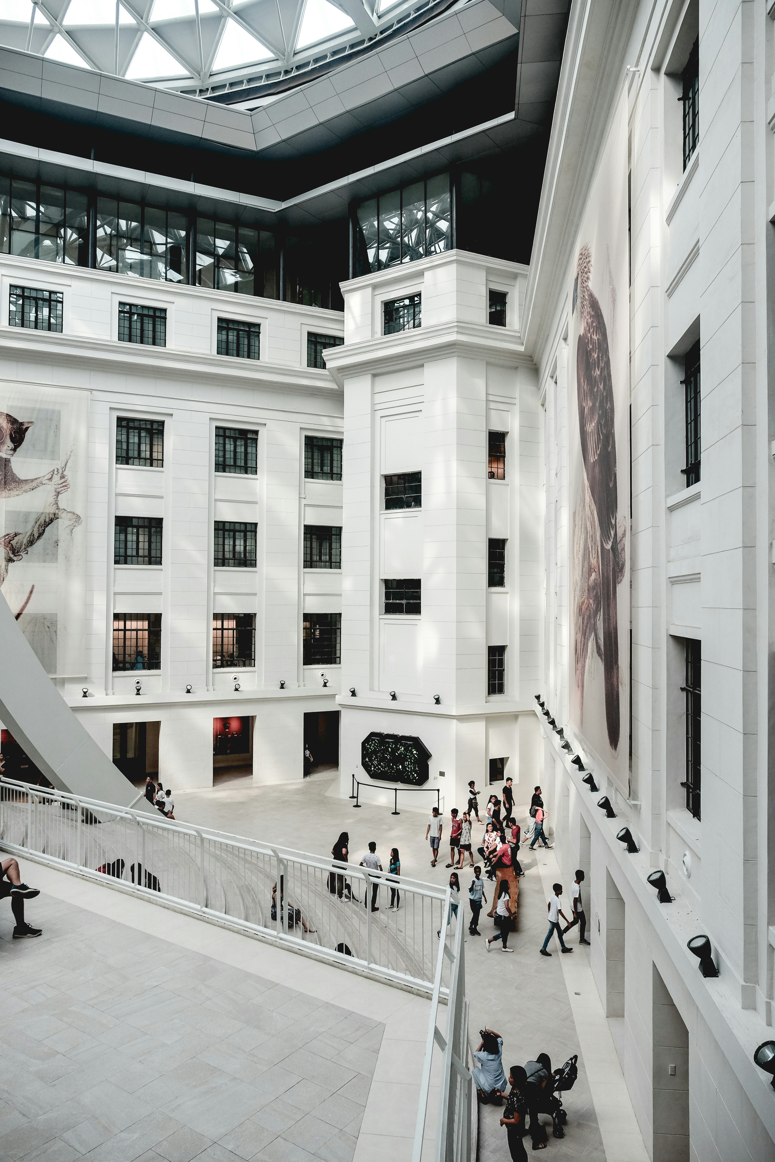 people walking on white concrete building